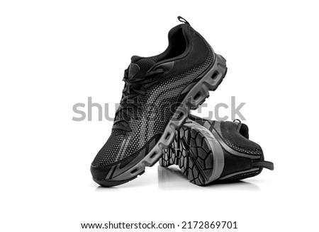 Sport shoes isolated on white background. Black sneakers running shoes. Royalty-Free Stock Photo #2172869701
