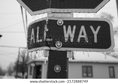Stop sign covered with ice winter