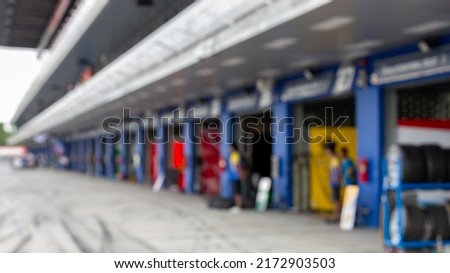 Blur car pit stop lane for race car being serviced , Pit stop for racing car. Royalty-Free Stock Photo #2172903503