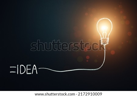 Idea concept. innovation, brainstorm, symbol. Light bulb plugged with word idea. Copy space.