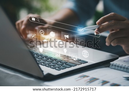 Person working with tcomputer laptop for manage search engine optimization : SEO with social media content and advertisement from website. Royalty-Free Stock Photo #2172915717