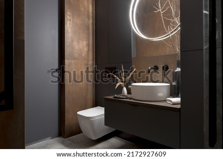 Modern bathroom with rusty tiles, stylish lighting and elegant decorations Royalty-Free Stock Photo #2172927609