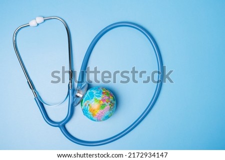 environment, ecology, planetary health, globe planet and stethoscope on blue background Royalty-Free Stock Photo #2172934147