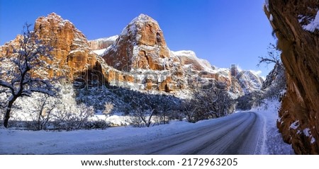 Snowy road in a mountain canyon in winter. Canyon road in snow. Snowy canyon road panorama. Canyon in winter snow Royalty-Free Stock Photo #2172963205