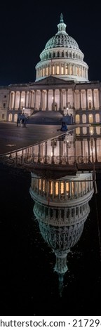 Tall Panoramic Picture of the US Capitol Dome Reflected on Water With Tourist walking and Sitting Around the Square