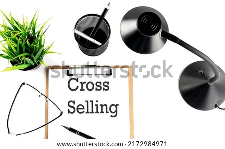 CROSS SELLING text on clipboard on the white background