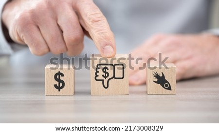 Wooden blocks with symbol of economic crash concept