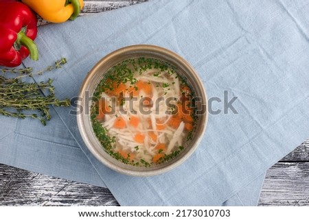 chicken soup, chicken soup on a white wooden background, top view