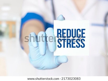 Reduce Stress card in hands of Medical Doctor Royalty-Free Stock Photo #2173023083