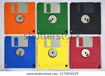 Set of six floppy disks of various colors forming a rectangle