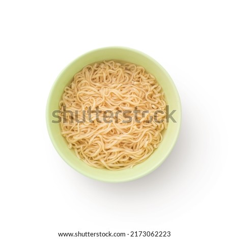 Yellow noodles in green cup isolated on white background , top view , flat lay.