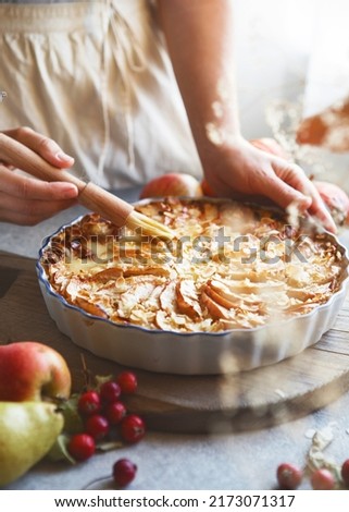 Apple pie. Piece of fresh baked homemade layered tart with fresh apples. Royalty-Free Stock Photo #2173071317