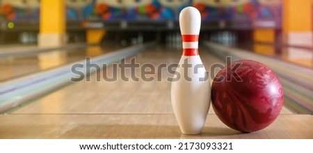 Ball and pin on floor in bowling club
