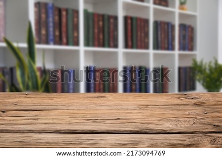 Empty wooden table in modern library