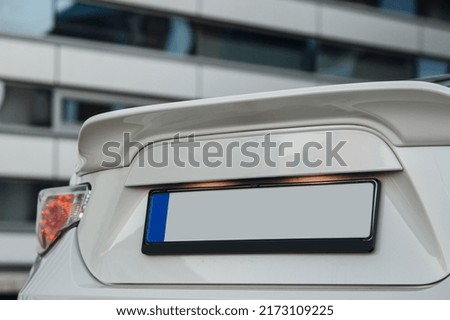 Modern coupe car rear trunk spoiler. Number plate with free space at the boot of a car Royalty-Free Stock Photo #2173109225