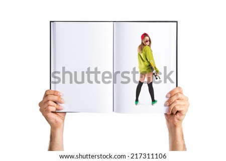 Pretty young girl wearing urban style printed on book