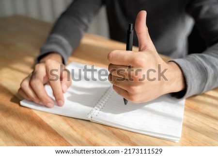Thumbs up of left hand. International Left-handers Day concept. Royalty-Free Stock Photo #2173111529