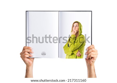 Young girl thinking printed on book