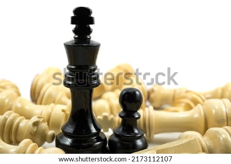 Tells about the struggle of a father (the king of white chess) who becomes a single parent for his son (a chess pawn) trying to never give up against enemies. A concept of passion for success. Royalty-Free Stock Photo #2173112107