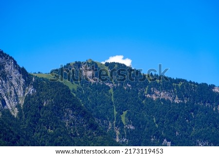 Mountain panorama seen from City of Altdorf, Canton Uri, on a sunny summer day. Photo taken June 25th, 2022, Altdorf, Switzerland.