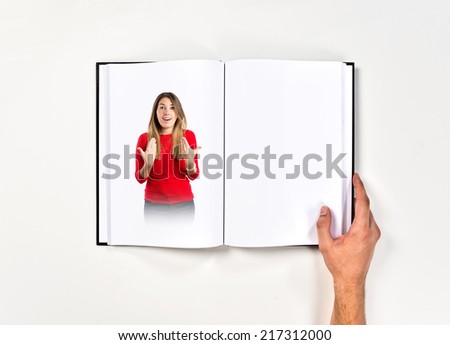 Young girl surprised printed on book