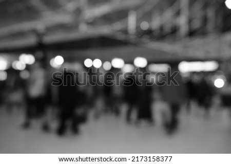 Blurred background. shopping mall with people. Christmas decorations. Black and white photo.