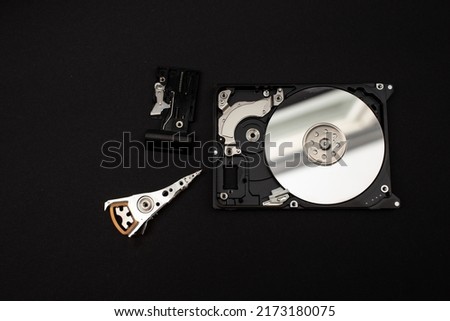 Laptop hard drive on black background