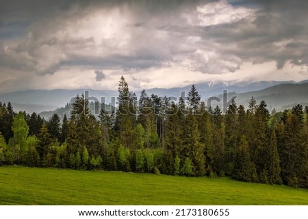 Spring cloudy landscape. The Muranska planina plateau national park with The Low Tatras mountain range at background, Slovakia, Europe.