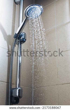shower with water stream, close-up view Royalty-Free Stock Photo #2173188067