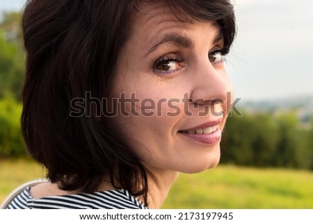Close-up portrait of a woman 40-44 years old with short black hair. Royalty-Free Stock Photo #2173197945
