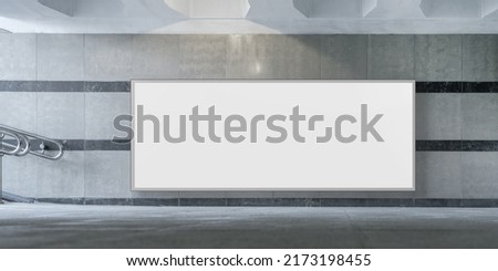 Big horizontal empty white banner with mock up space fixed on wall of subway passage Royalty-Free Stock Photo #2173198455