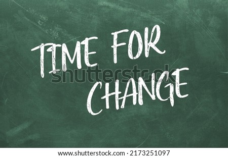 Time For Change written on the green chalkboard