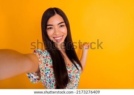 Photo of pretty positive lady arm palm demonstrate empty space way isolated on yellow color background