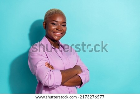 Profile portrait of cheerful charming person crossed arms toothy smile isolated on teal color background