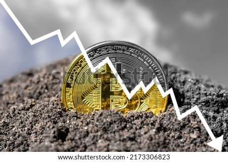 Bitcoin and falling price chart. Decrease in quotes on the crypto market. Crypto winter. Royalty-Free Stock Photo #2173306823