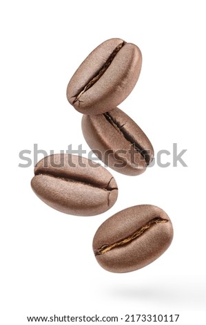 Flying delicious coffee beans, isolated on white background Royalty-Free Stock Photo #2173310117