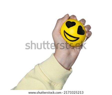 Woman squeezing antistress ball with funny face on white background, closeup Royalty-Free Stock Photo #2173325213