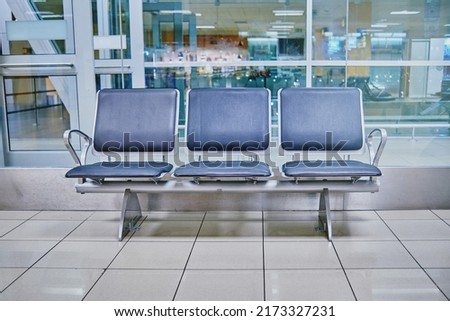 Empty airport with blurred plane on a background Royalty-Free Stock Photo #2173327231