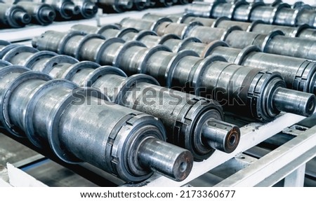 Plant for production of agricultural machinery. Metal cylindrical parts for combines or tractors Royalty-Free Stock Photo #2173360677