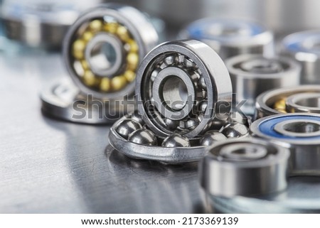 different bearings on a metal background. Part of mechanism. Royalty-Free Stock Photo #2173369139