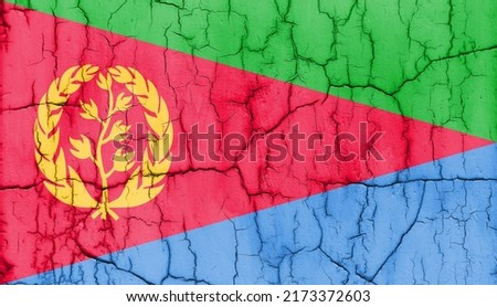 Textured photo of the flag of Eritrea with cracks.