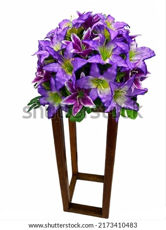 looks beautiful the arrangement of blooming flowers looks beautiful on a wooden pole