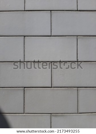 wall with white ceramic pattern