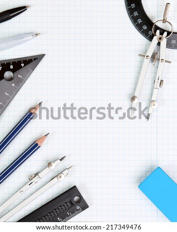 Background - drawing tools on white notebook sheet in the box