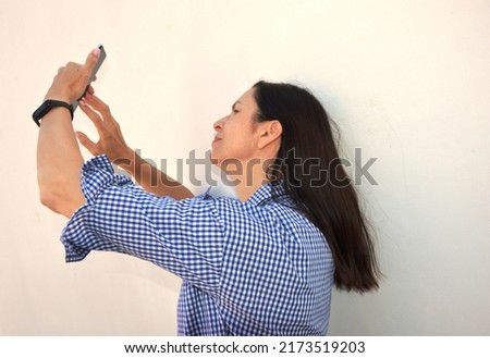 The girl takes a picture of herself. Selfie