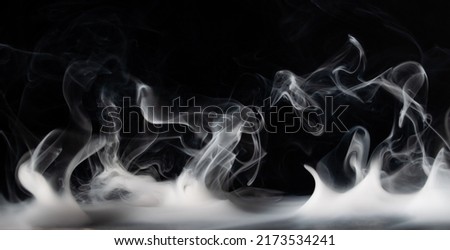 Abstract smoke on a dark background .