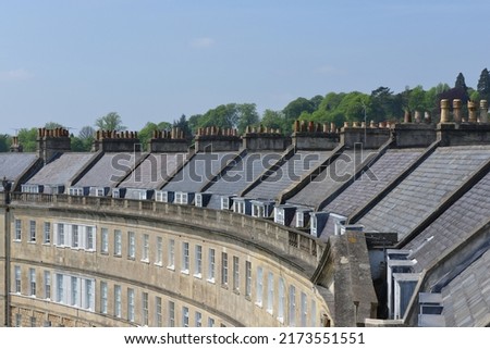 Exterior view of an attractive Georgian era crescent of town houses in Bath England - the Somerset city if famous for its beautiful architecture