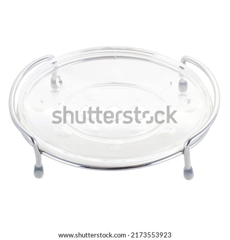 transparent plastic soap dish with a metal stand on a white background
