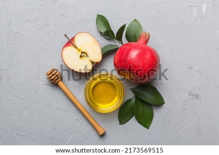 Flat lay composition with symbols jewish Rosh Hashanah holiday attributes on colored background, Rosh hashanah concept. New Year holiday Traditional. Top view with copy space.