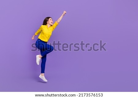 Full length body size view of attractive cheery energetic girl jumping striving isolated over bright violet purple color background Royalty-Free Stock Photo #2173576153